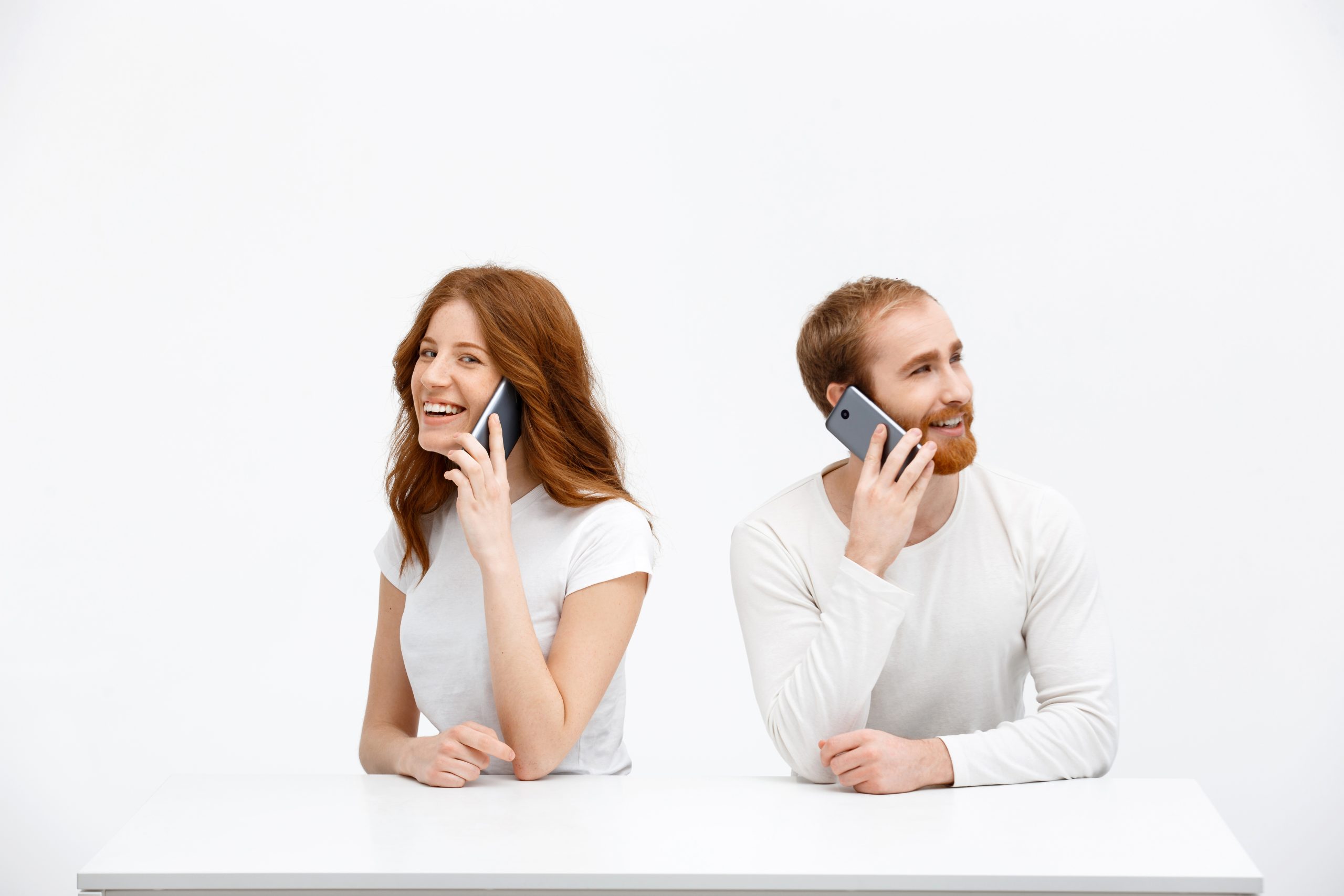 cheerful redhead woman man talk mobile phone scaled